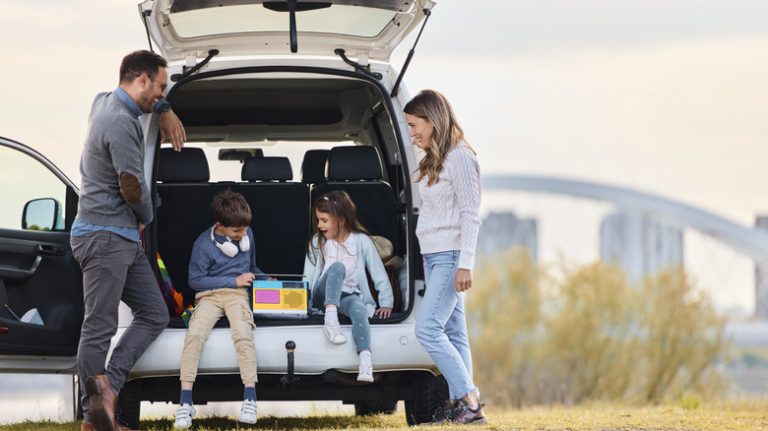 family in back of car