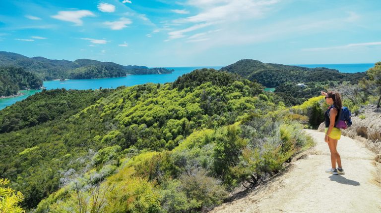 Woman hiking the Abel Tasman Coast Track