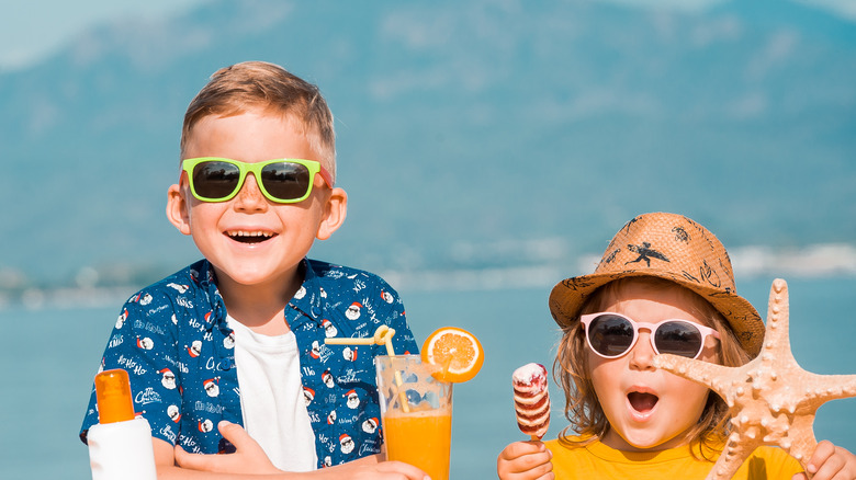 Kids with snacks on beach