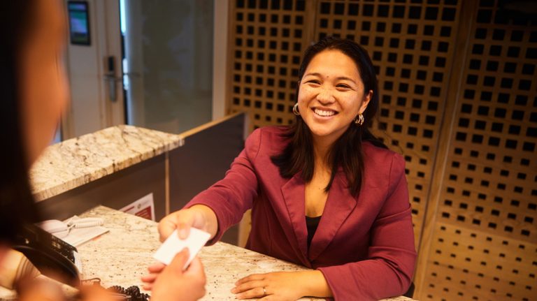 hotel concierge handing business card