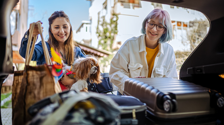 Women packing a car