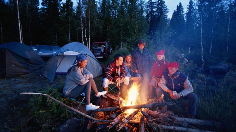 family around campfire