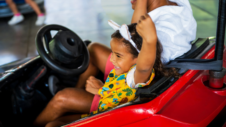 child on bumper cars