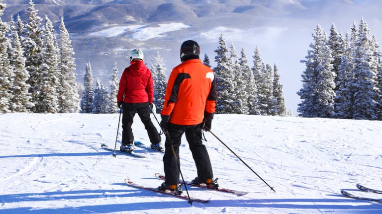 Two skiers on a slope