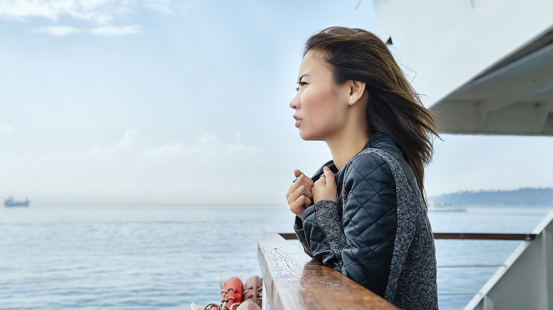 woman on ship dock looking out