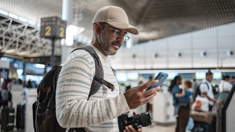 Man with camera and phone