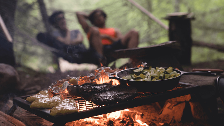 food cooking on campfire