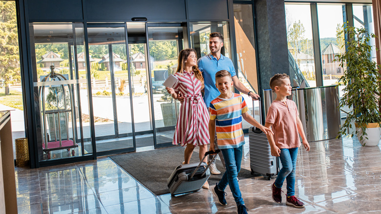 Family entering a hotel