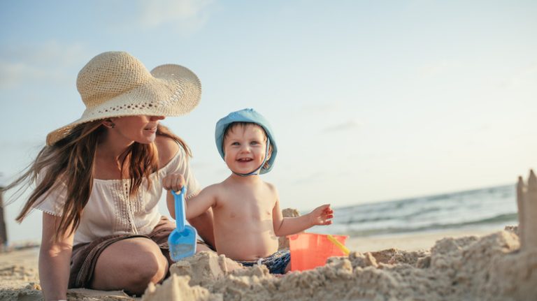 Toddler playing at beach