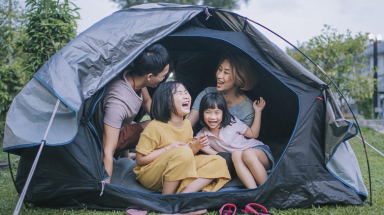 Family camping in tent