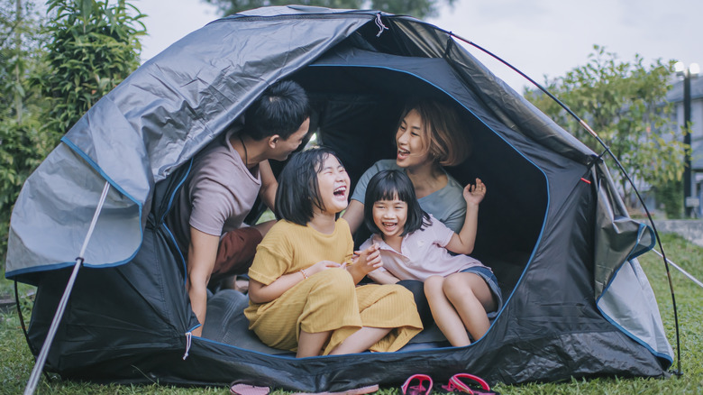 Family camping in tent