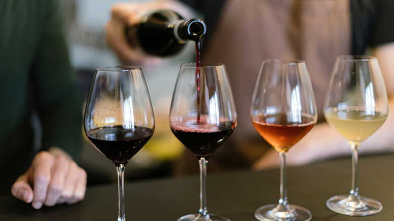 waiter pouring wine flight