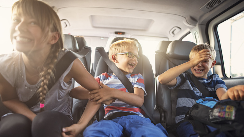 kids enjoying a car ride