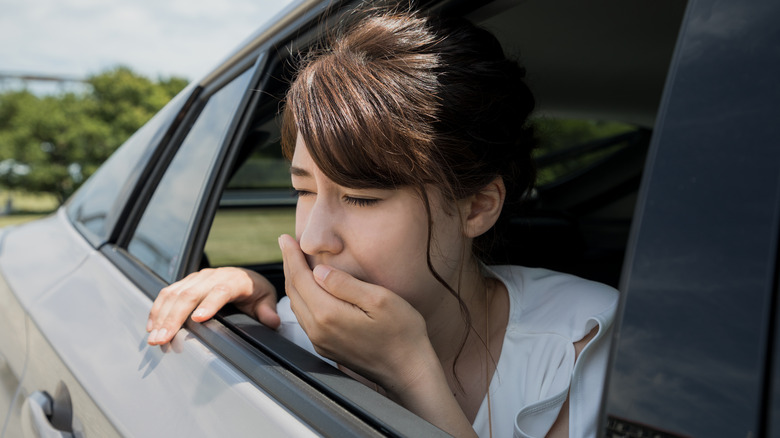 Woman feeling car sick