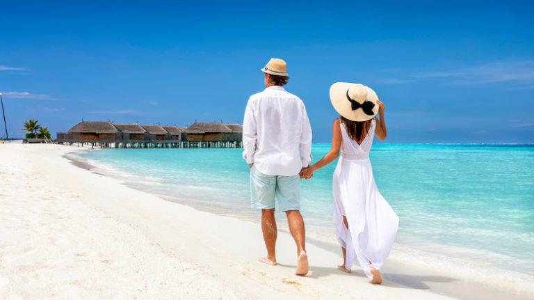 walking on beach in Maldives