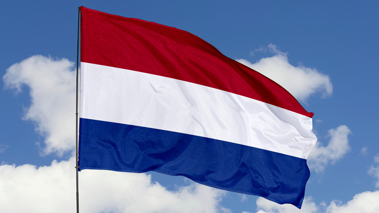 dutch flag against the sky