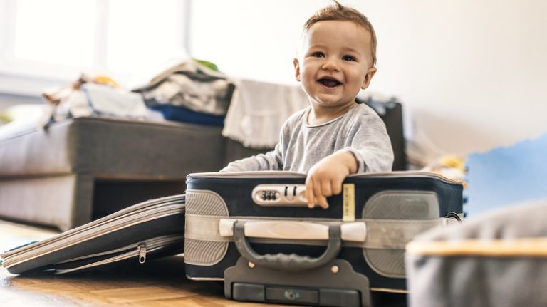 Father and son with matching suitcases