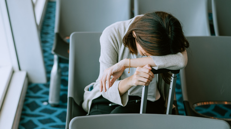 Woman asleep in an airport