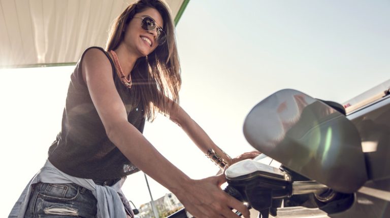 woman pumping gas