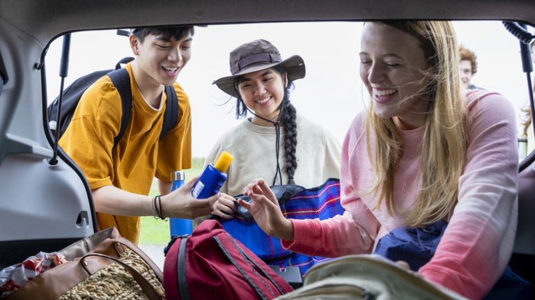 Friends packing for road trip