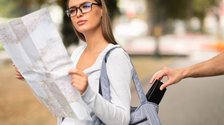 woman pickpocketed looking at map