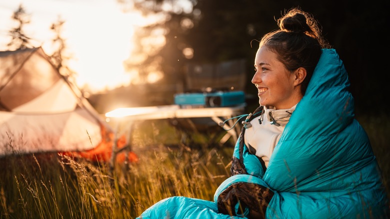 woman wrapped in sleeping bag