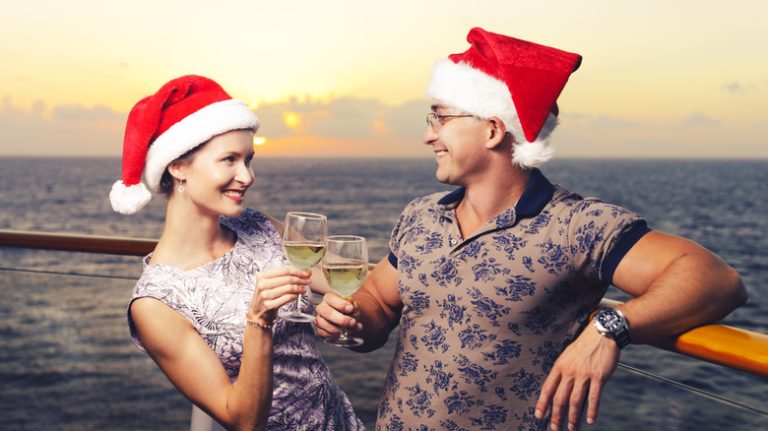 Couple on a cruise ship in Santa hats