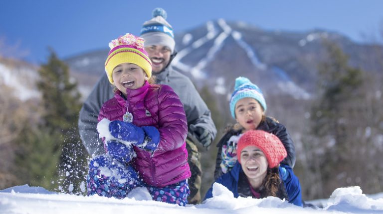 Family playing in the snow